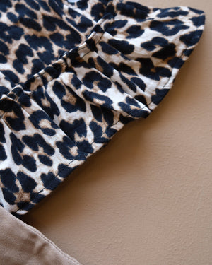 Leopard-print sleeveless top with beige shorts two-piece outfit