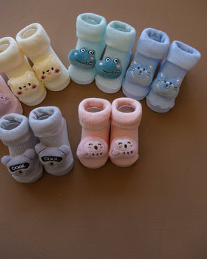 Assorted pastel baby socks with embroidered animal faces