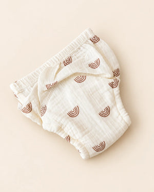 Reusable off-white cloth diaper with playful printed designs