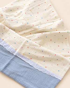 Decorative baby blanket with assorted prints and scalloped trim