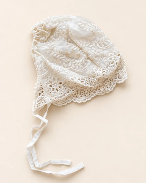 Delicate floral lace baby bonnet with tie straps