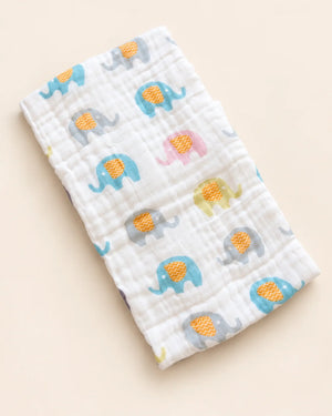 Printed muslin baby towel with playful elephant, unicorn, vehicle, and multicolor designs