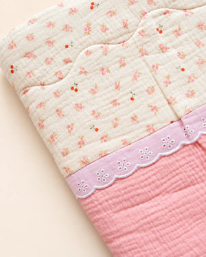 Decorative baby blanket with assorted prints and scalloped trim