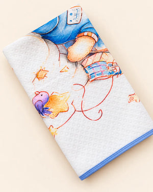 Printed white baby dry sheet with quilted texture and playful nursery illustrations