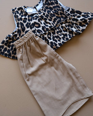 Leopard-print sleeveless top with beige shorts two-piece outfit