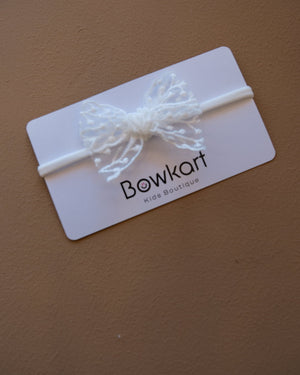Baby headband with a delicate floral lace bow