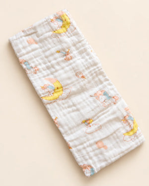 Printed muslin baby towel with playful elephant, unicorn, vehicle, and multicolor designs