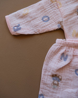 Pale blue baby clothing set with bear and letter prints