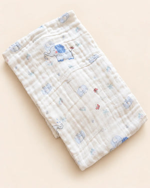 Printed muslin baby towel with playful elephant, unicorn, vehicle, and multicolor designs