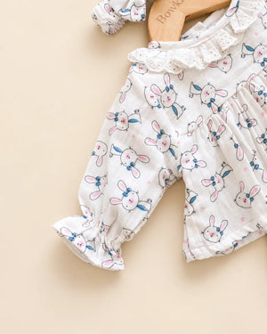 White bunny print baby clothing set with ruffled top, bloomers, and matching headband