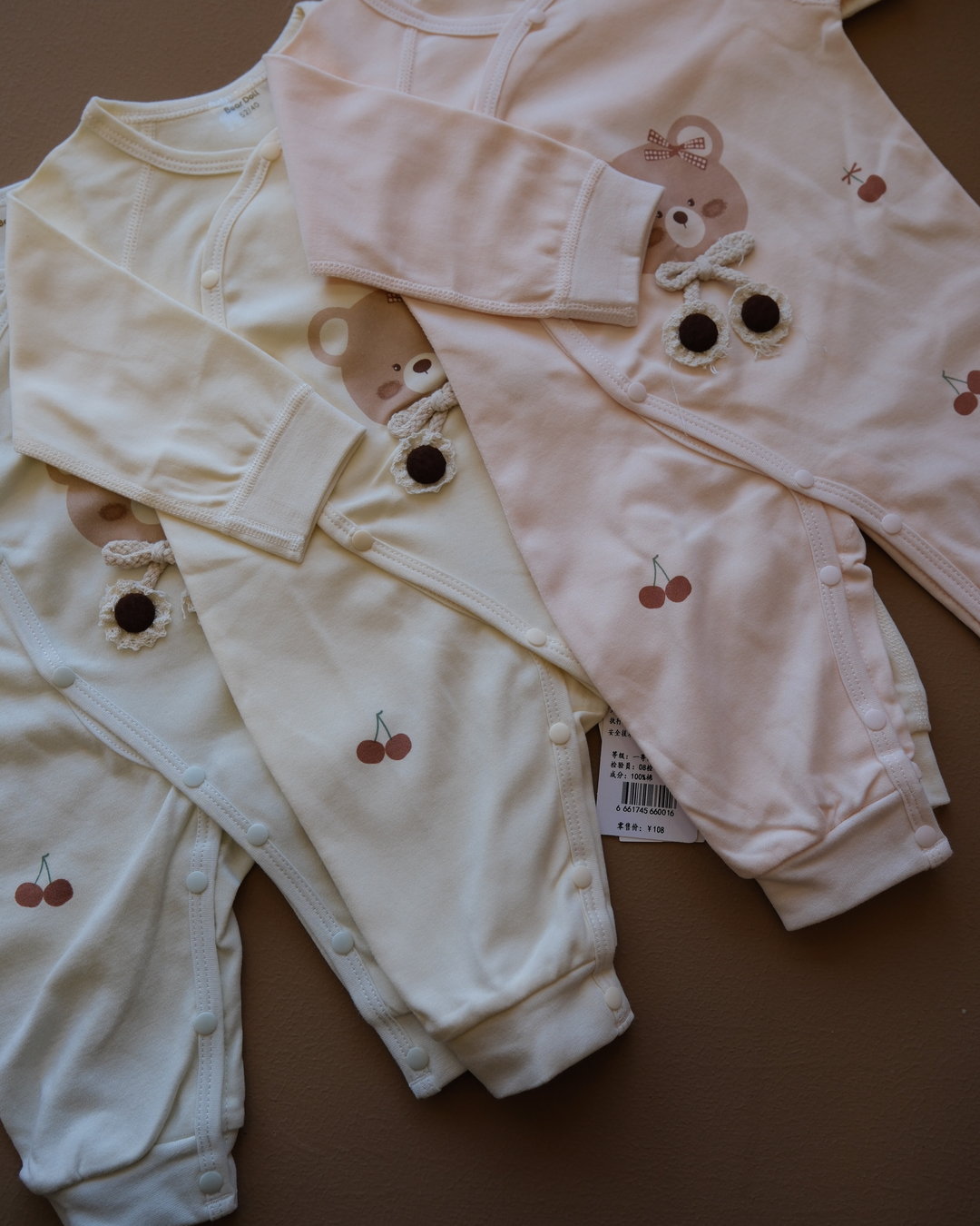 Long-sleeve baby cotton sleepsuit with bear and cherry prints