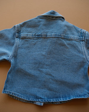 Blue long-sleeve collared baby shirt with button closure and chest pockets