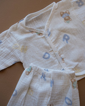 Pale blue baby clothing set with bear and letter prints