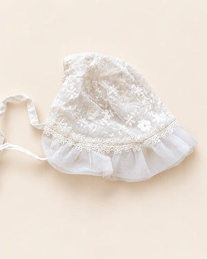 Delicate floral lace baby bonnet with tie straps
