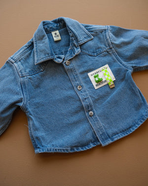 Blue long-sleeve collared baby shirt with button closure and chest pockets