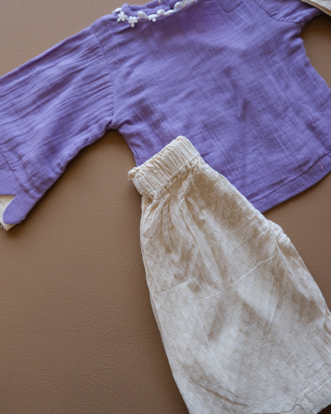 Girls' purple floral-trim top with coordinating off-white pants