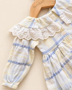 Pastel plaid girls' frock with lace-trimmed collar and long sleeves