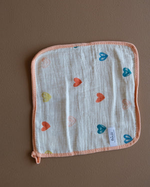 Muslin crepe baby washcloth with pastel animal and heart prints