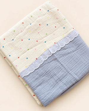 Decorative baby blanket with assorted prints and scalloped trim