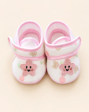 Baby booties with star applique, bear print, and pastel trim