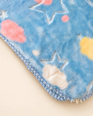 Blue and pink baby blanket with star, moon and cloud patterns