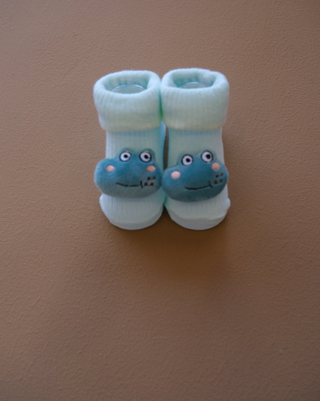 Assorted pastel baby socks with embroidered animal faces