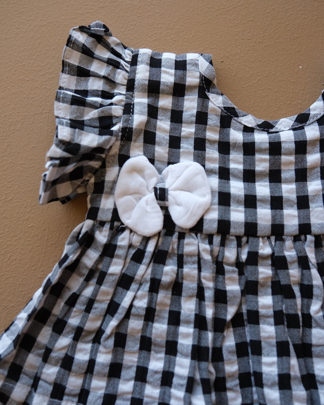 Black and white gingham girls frock set with bow detail and matching white shorts