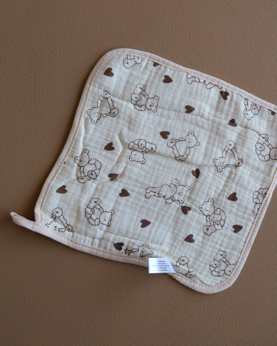 Assorted printed baby washcloths with colorful animal, floral, rainbow, and playful designs