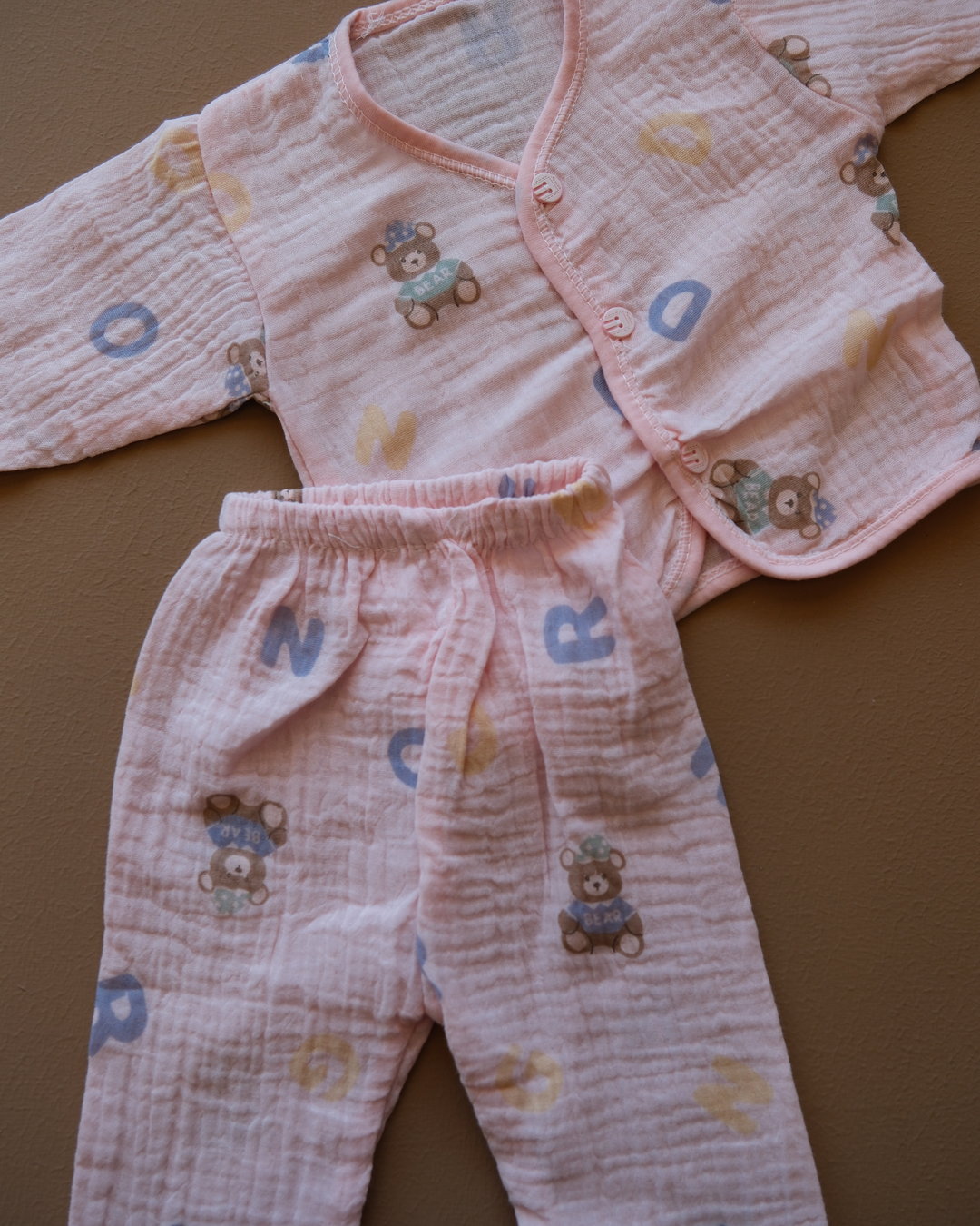 Pale blue baby clothing set with bear and letter prints