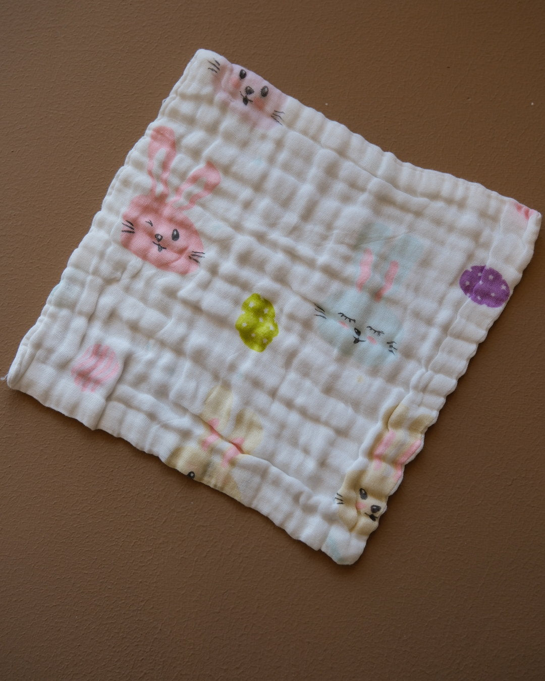 Six-layer white muslin baby face towel with assorted colorful printed designs