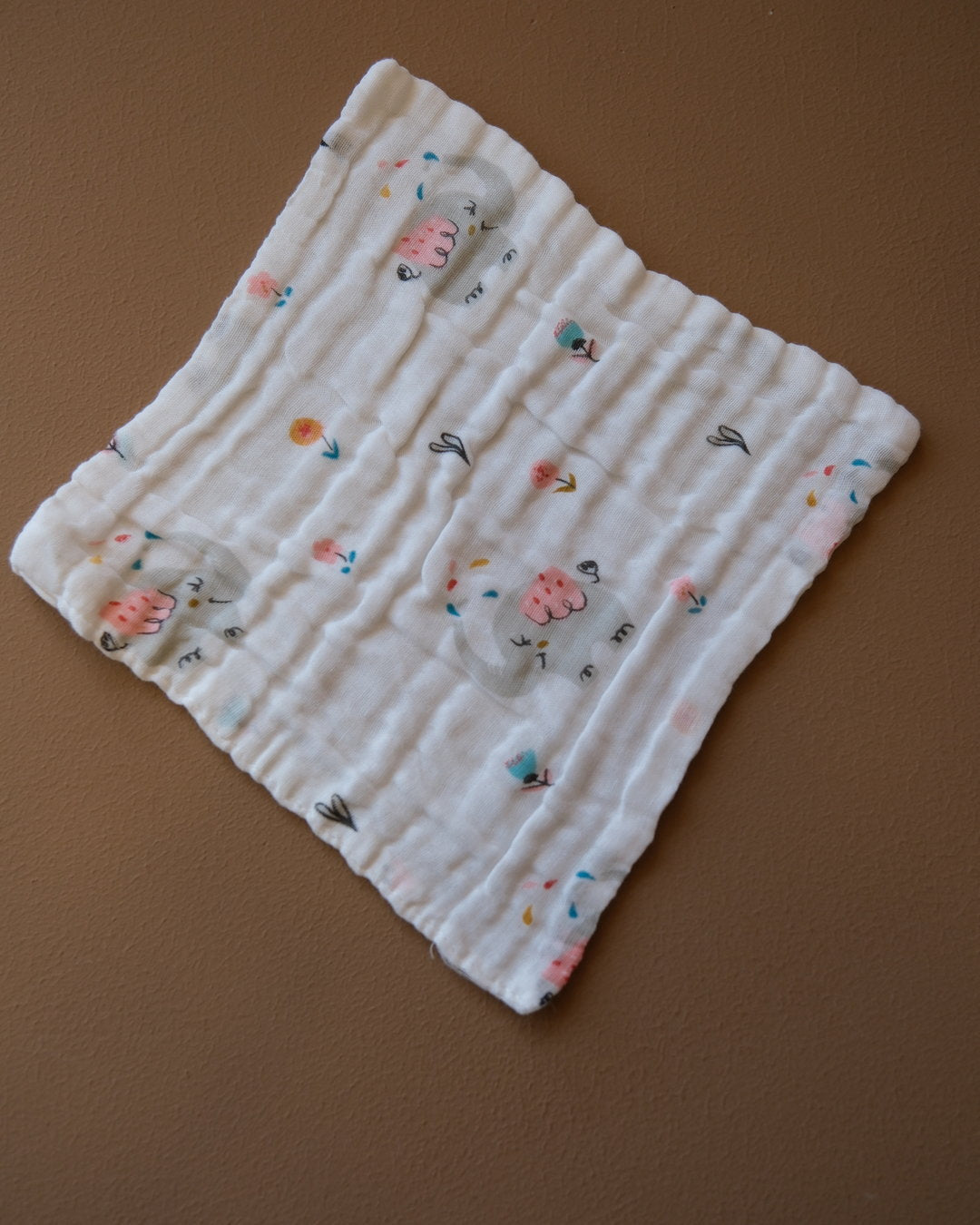Six-layer white muslin baby face towel with assorted colorful printed designs