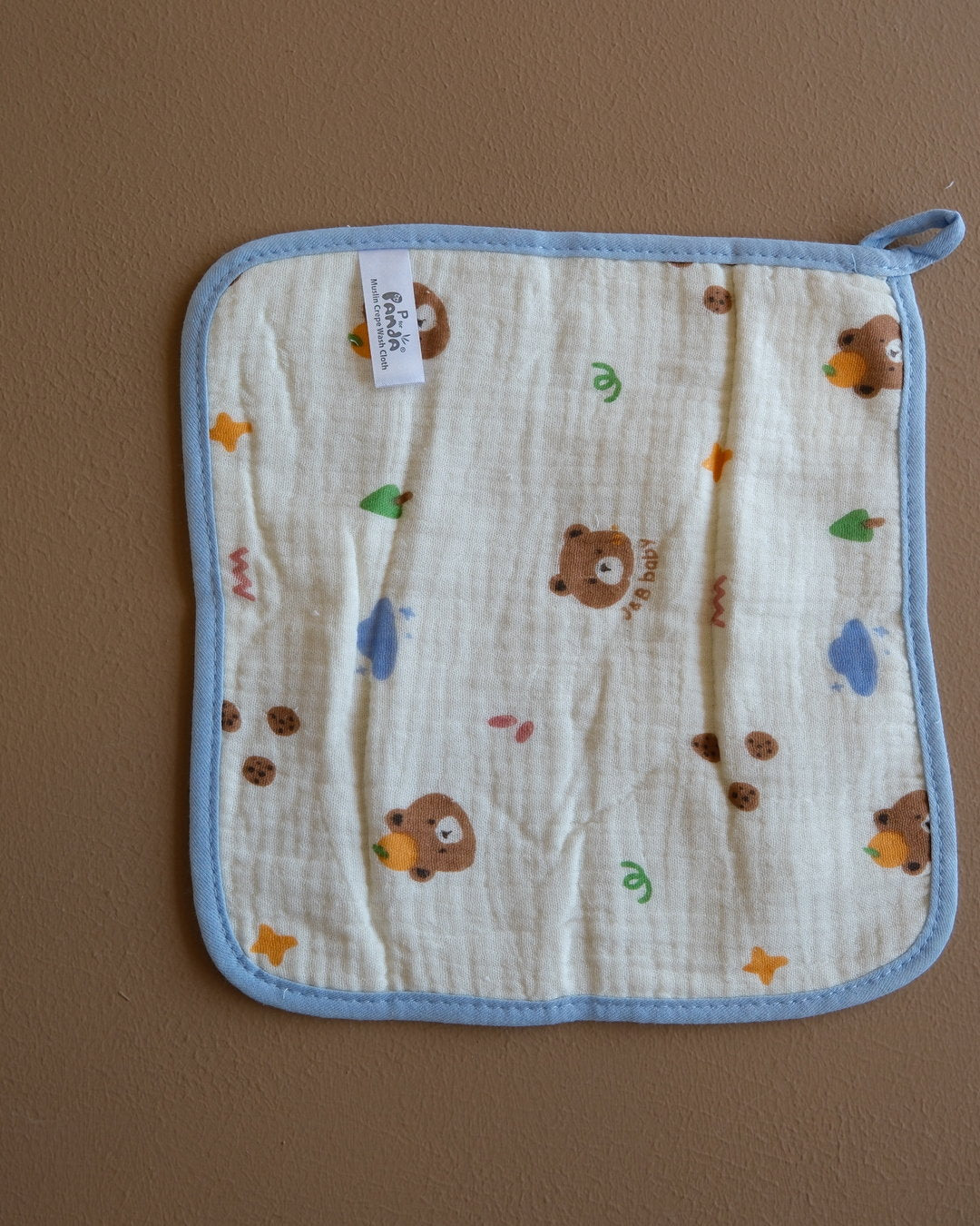 Assorted printed baby washcloths with colorful animal, floral, rainbow, and playful designs