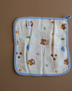 Assorted printed baby washcloths with colorful animal, floral, rainbow, and playful designs