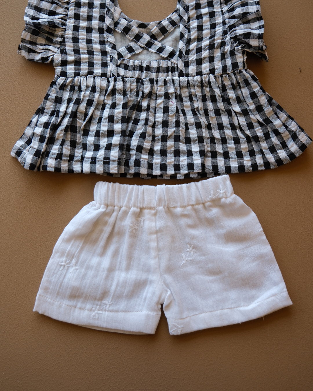 Black and white gingham girls frock set with bow detail and matching white shorts