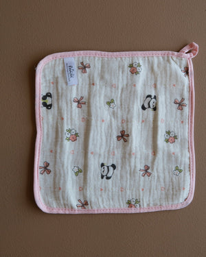 Assorted printed baby washcloths with colorful animal, floral, rainbow, and playful designs