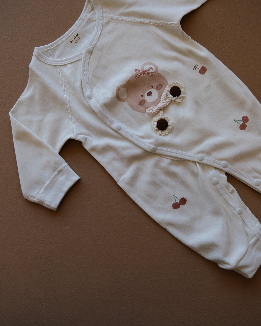 Long-sleeve baby cotton sleepsuit with bear and cherry prints