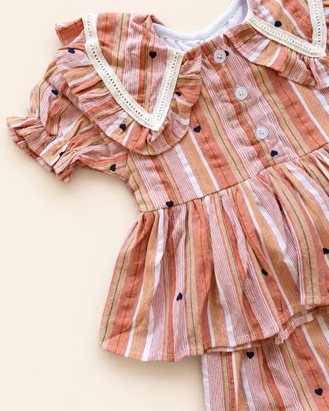 Striped girls frock set with heart motifs, ruffled sleeves, lace trim, and matching pants
