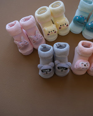 Assorted pastel baby socks with embroidered animal faces
