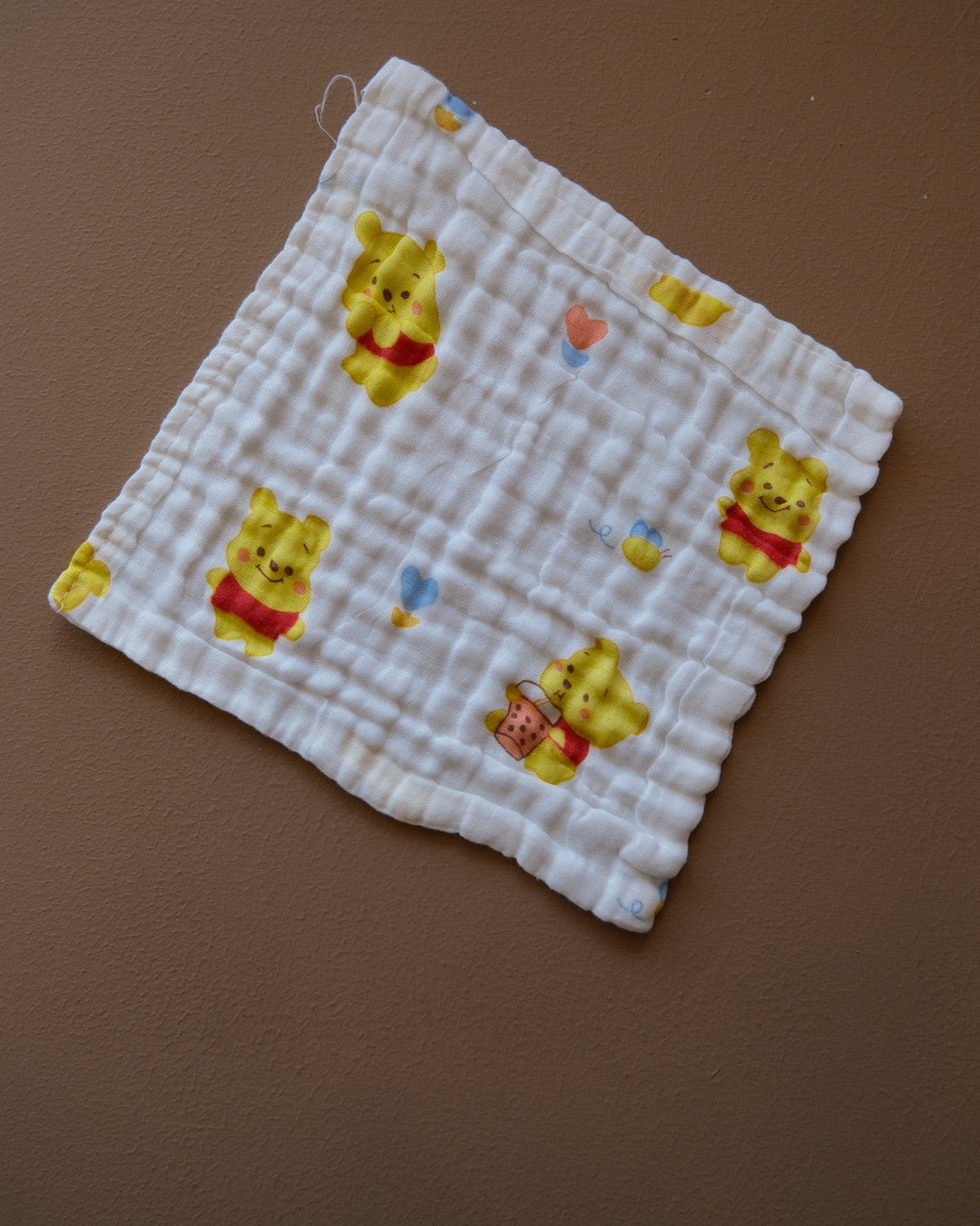Six-layer white muslin baby face towel with assorted colorful printed designs