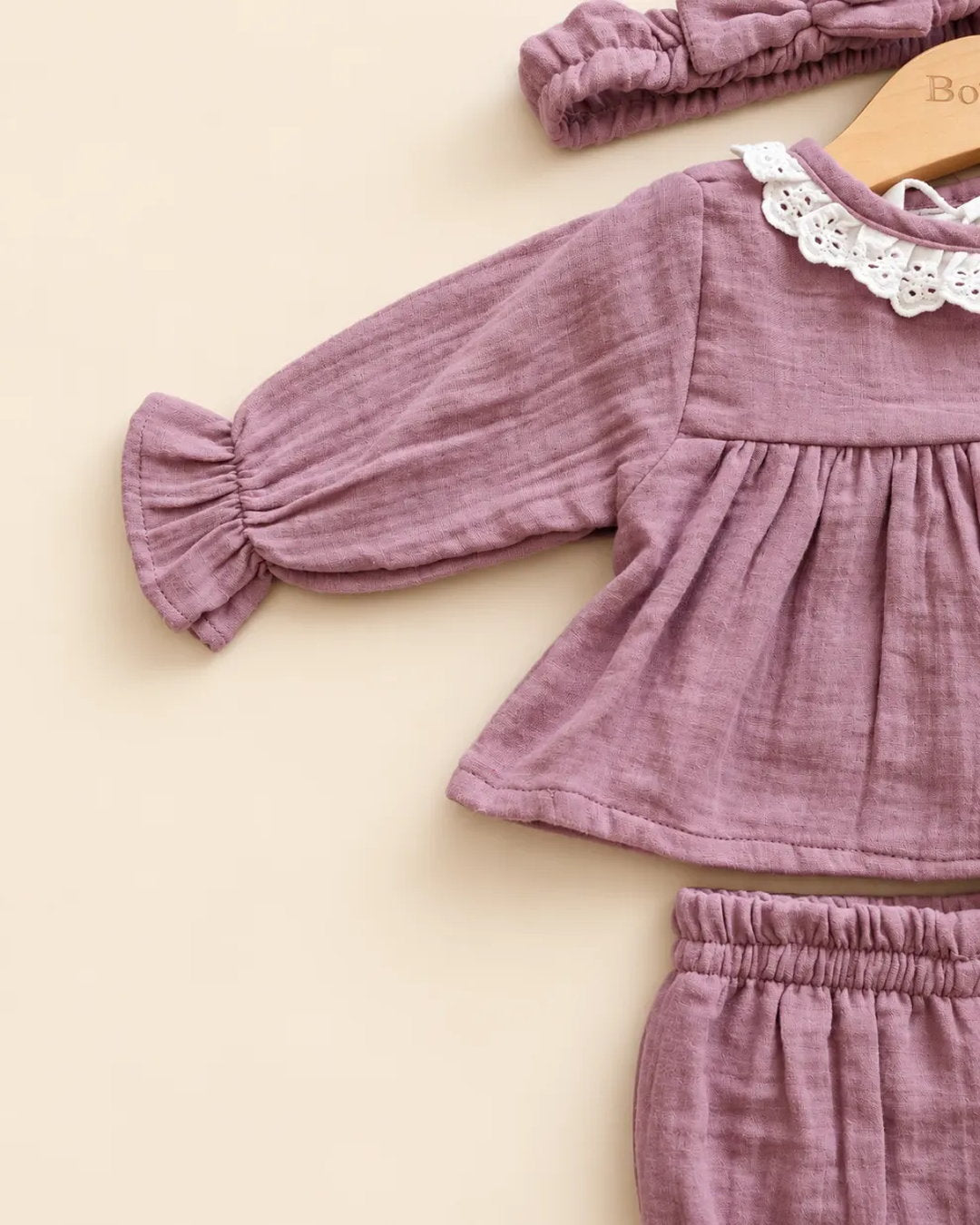 Dusty mauve baby girls' frock set with lace collar, matching bloomers, and bow headband