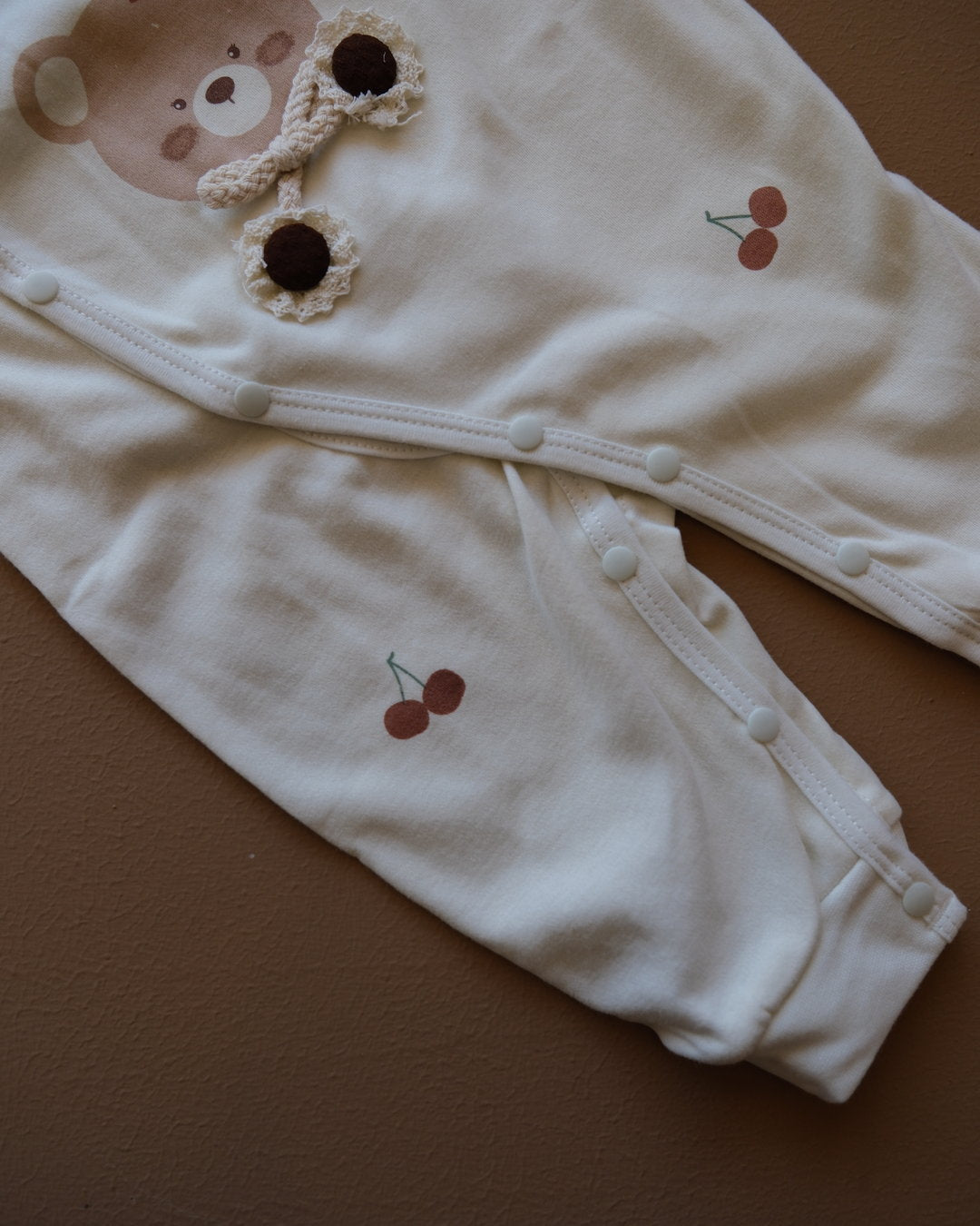 Long-sleeve baby cotton sleepsuit with bear and cherry prints