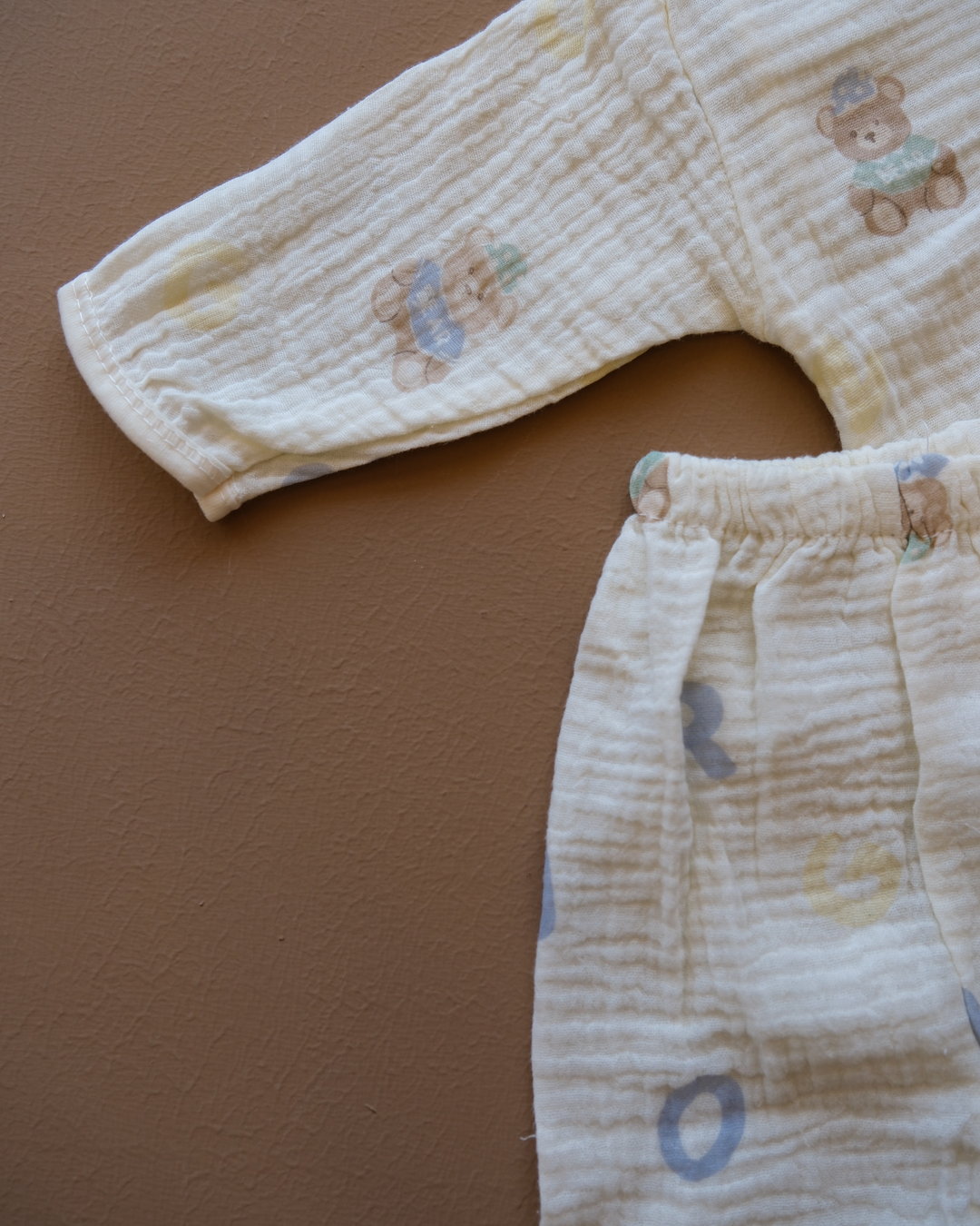 Pale blue baby clothing set with bear and letter prints