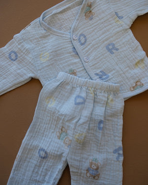 Pale blue baby clothing set with bear and letter prints