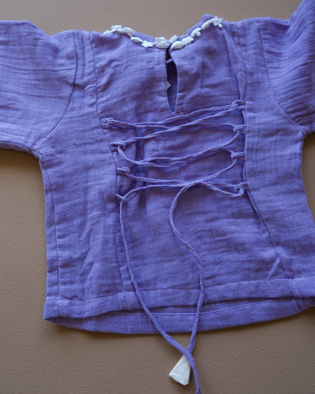 Girls' purple floral-trim top with coordinating off-white pants