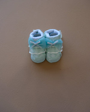 Newborn baby socks with decorative bows in pastel colors