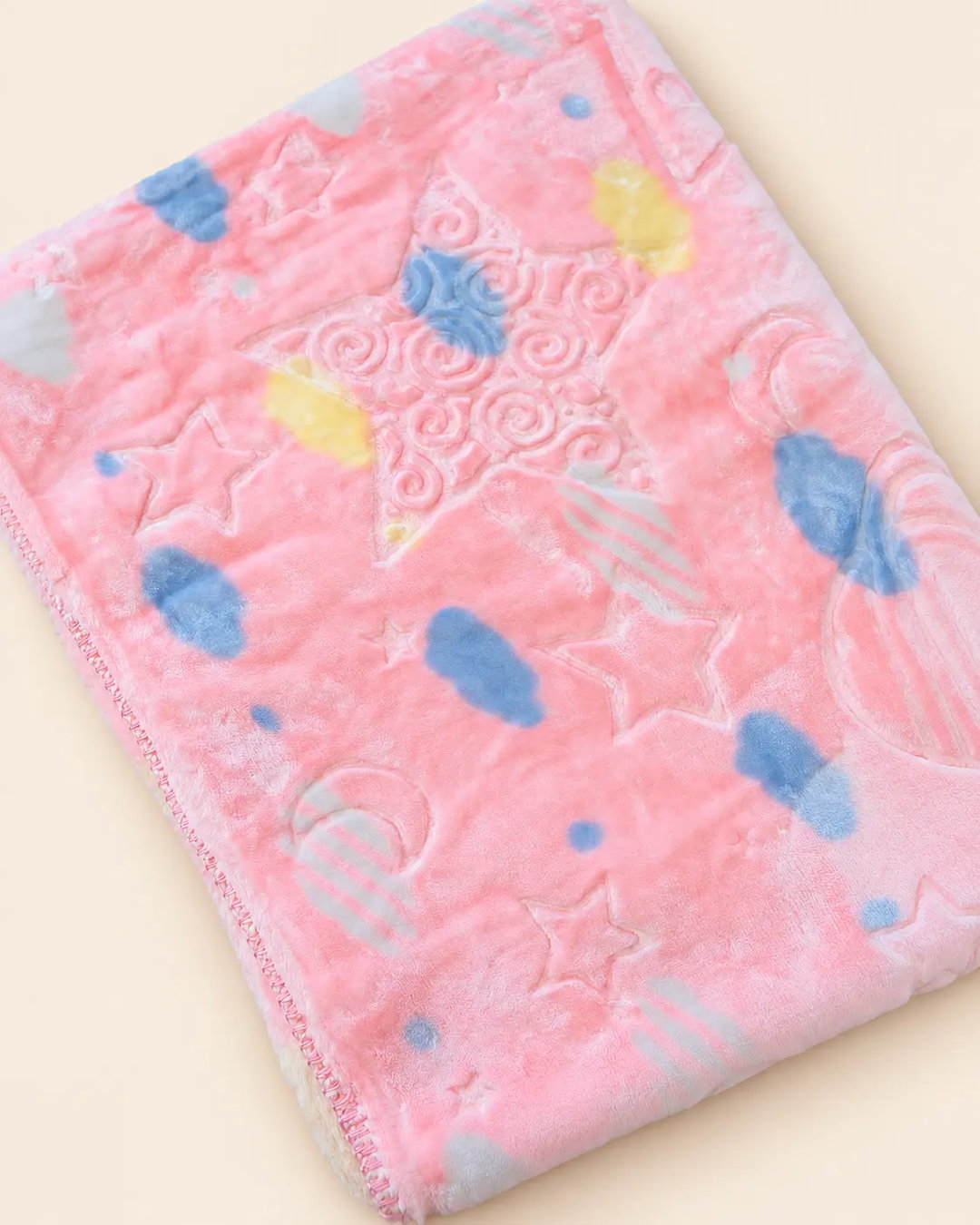 Blue and pink baby blanket with star, moon and cloud patterns