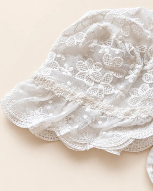 Delicate floral lace baby bonnet with tie straps