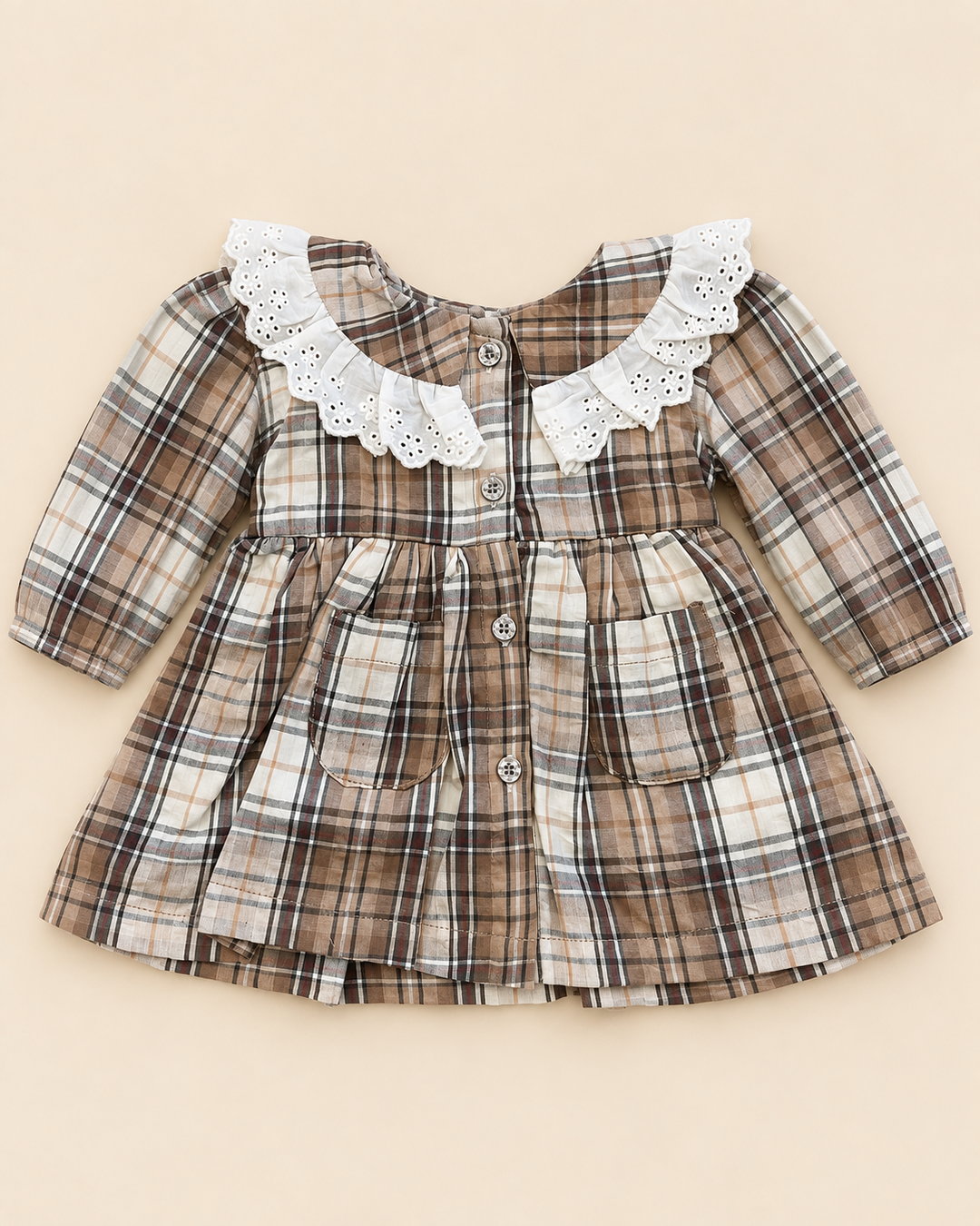 Brown and cream plaid children's frock with an eyelet collar, long sleeves, buttons, and front pockets