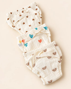 Reusable off-white cloth diaper with playful printed designs