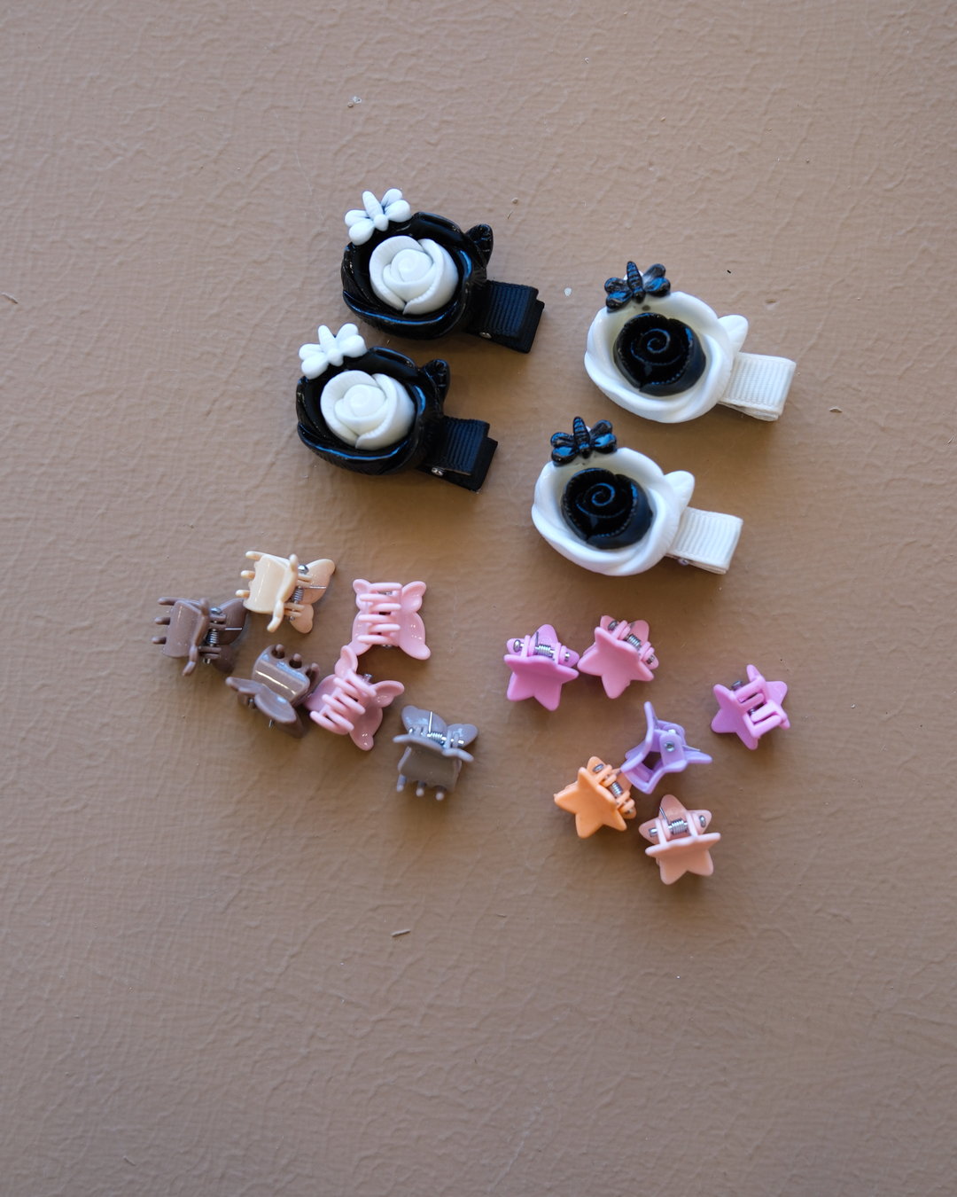Assorted colorful decorative hair clips with bows, flowers, and playful motifs